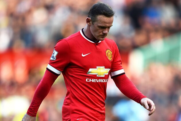 MANCHESTER, ENGLAND - SEPTEMBER 27:  Wayne Rooney of Manchester United walks off the pitch after receiving a straight red card following a foul on Stewart Downing of West Ham during the Barclays Premier League match between Manchester United and West Ham United at Old Trafford on September 27, 2014 in Manchester, England.  (Photo by Laurence Griffiths/Getty Images)