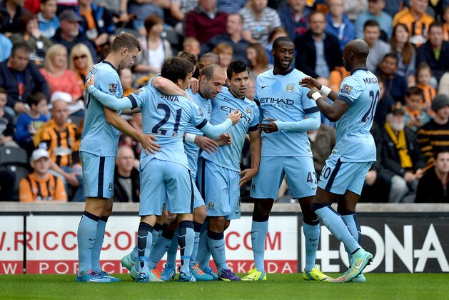 HULL, ENGLAND - SEPTEMBER 27:  Sergio Aguero (C) of Manchester City celebrates with team-mates after scoring the opening goal during the Barclays Premier League match between Hull City and Manchester City at KC Stadium on September 27, 2014 in Hull, England.  (Photo by Gareth Copley/Getty Images)