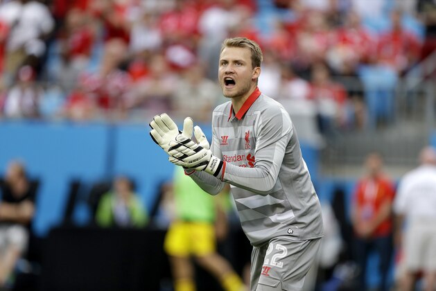 Liverpool's goalkeeper Simon Mignolet (22) cheers on his teammates against AC Milan during a Guinness International Champions Cup soccer match in Charlotte, N.C., Saturday, Aug. 2, 2014. Liverpool won 2-0. (AP Photo/Bob Leverone)