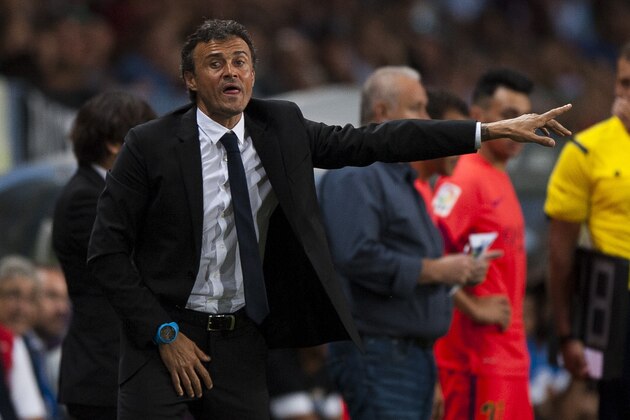 FC Barcelona's coach Luis Enrique gestures during a Spanish La Liga soccer match between Malaga and Barcelona at La Rosaleda stadium in Malaga, Spain, Wednesday, Sept. 24, 2014. (AP Photo/Daniel Tejedor)