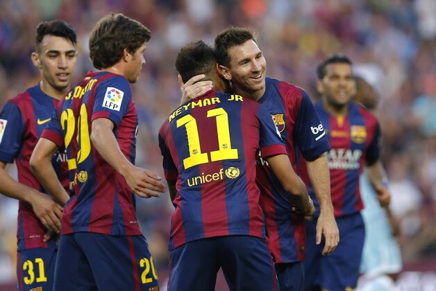 Barcelona's Neymar from Brazil celebrates with Lionel Messi from Argentina scoring his side's fifth goal during a Spanish La Liga soccer match between F.C. Barcelona and Granada C.F. at the Camp Nou stadium in Barcelona, Spain, Saturday, Sept. 27, 2014. (AP Photo/Emilio Morenatti)