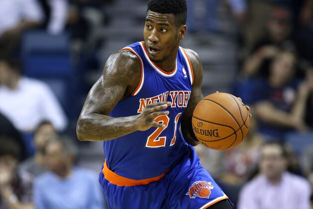 New York Knicks shooting guard Iman Shumpert (21) drives with the ball during the first quarter of an NBA basketball game in New Orleans, Wednesday, Feb. 19, 2014. (AP Photo/Jonathan Bachman)