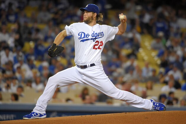 Los Angeles Dodgers starting pitcher Clayton Kershaw throws to the plate during the first inning of a baseball game against the San Francisco Giants, Wednesday, Sept. 24, 2014, in Los Angeles. (AP Photo/Mark J. Terrill)