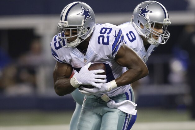 Dallas Cowboys' DeMarco Murray (29) takes a hand off from quarterback Tony Romo during the second half of an NFL football game against the New Orleans Saints, Sunday, Sept. 28, 2014, in Arlington, Texas. (AP Photo/Tim Sharp)
