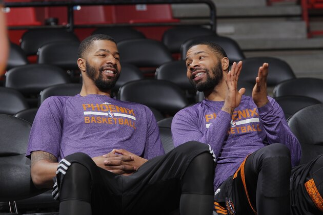 SACRAMENTO, CA - APRIL 16: Markieff Morris #11 and Marcus Morris #15 of the Phoenix Suns prior to the game against the Sacramento Kings on April16, 2014 at Sleep Train Arena in Sacramento, California. NOTE TO USER: User expressly acknowledges and agrees that, by downloading and or using this photograph, User is consenting to the terms and conditions of the Getty Images Agreement. Mandatory Copyright Notice: Copyright 2014 NBAE (Photo by Rocky Widner/NBAE via Getty Images)