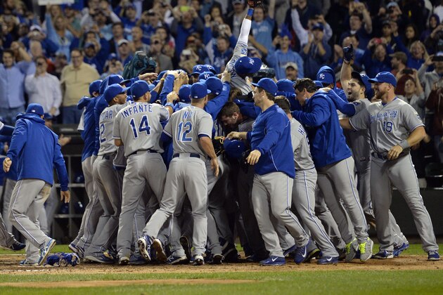 CHICAGO, IL - SEPTEMBER 26:  The Kansas City Royals celebrate after the final out of the game against the Chicago White Sox at U.S. Cellular Field on September 26, 2014 in Chicago, Illinois. The Royals defeated the White Sox 3-1 to clinch a wildcard spot.  (Photo by Brian Kersey/Getty Images)