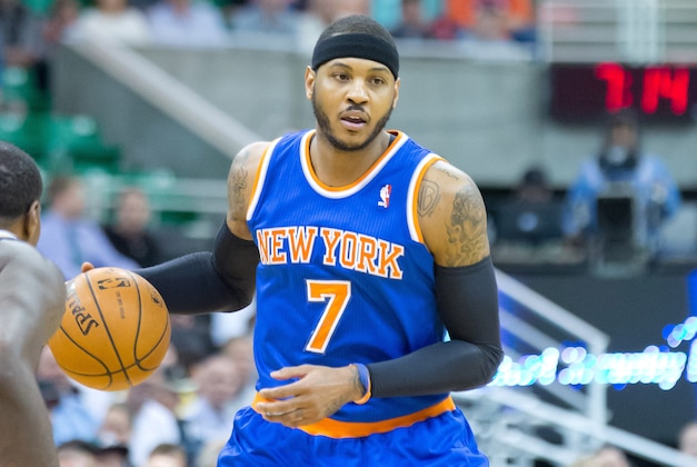 Mar 31, 2014; Salt Lake City, UT, USA; New York Knicks forward Carmelo Anthony (7) dribbles the ball during the first quarter against the Utah Jazz at EnergySolutions Arena. Mandatory Credit: Russ Isabella-USA TODAY Sports