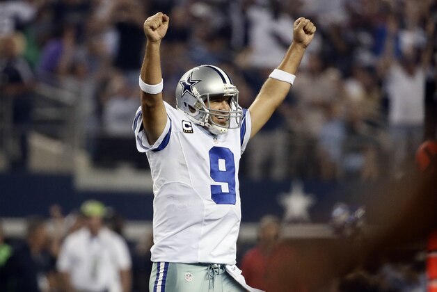 Dallas Cowboys' Tony Romo celebrates a touchdown runby DeMarco Murray during the second half of an NFL football game against the New Orleans Saints, Sunday, Sept. 28, 2014, in Arlington, Texas. (AP Photo/Brandon Wade)