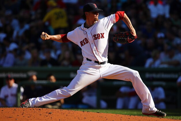 BOSTON, MA - SEPTEMBER 28:  Clay Buchholz #11 of the Boston Red Sox pitches to the New York Yankees during the last game of the season at Fenway Park on September 28, 2014 in Boston, Massachusetts.  (Photo by Al Bello/Getty Images)