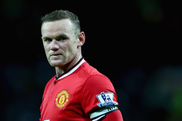 MANCHESTER, ENGLAND - AUGUST 12:  Wayne Rooney of Manchester United in action during the Pre Season Friendly match between Manchester United and Valencia at Old Trafford on August 12, 2014 in Manchester, England.  (Photo by Clive Brunskill/Getty Images)