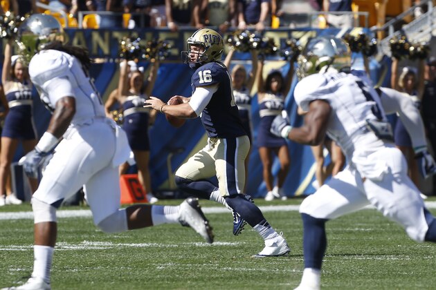 Pittsburgh quarterback Chad Voytik (16) plays in the first half of the NCAA football game between Pittsburgh and Akron on Saturday, Sept. 27, 2014 in Pittsburgh. (AP Photo/Keith Srakocic)