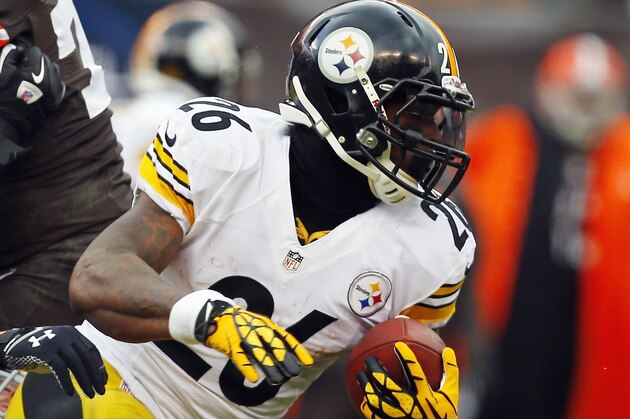 CLEVELAND, OH - NOVEMBER 24:  Running back Le'Veon Bell #26 of the Pittsburgh Steelers runs the ball by linebacker Paul Kruger #99 of the Cleveland Browns at FirstEnergy Stadium on November 24, 2013 in Cleveland, Ohio.  (Photo by Matt Sullivan/Getty Images)
