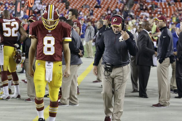 Washington Redskins quarterback Kirk Cousins (8) walks off the field during the second half of an NFL Thursday night football game against the New York Giants in Landover, Md., Thursday, Sept. 25, 2014. The Giants defeated the Redskins 45-14. (AP Photo/Patrick Semansky)