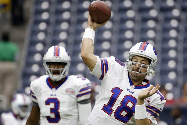 Buffalo Bills' Kyle Orton (18) throws as EJ Manuel (3) looks on prior to an NFL football game against the Houston, Sunday, Sept. 28, 2014, in Houston. (AP Photo/David J. Phillip)