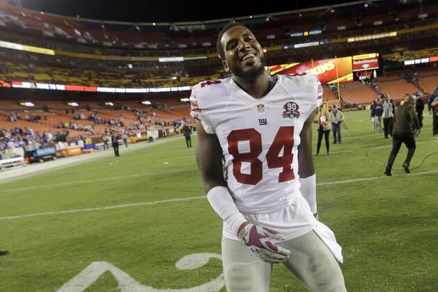 New York Giants tight end Larry Donnell (84) smiles as he leaves the field after an NFL Thursday night football game against the Washington Redskins in Landover, Md., Thursday, Sept. 25, 2014. The Giants defeated the Redskins 45-14. (AP Photo/Patrick Semansky)