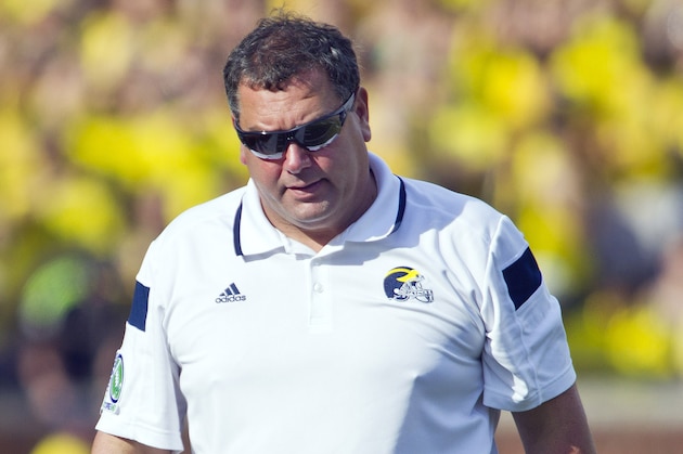 Michigan head coach Brady Hoke, right, reacts on the sideline next to defensive coordinator Greg Mattison, left, in the second quarter of an NCAA college football game against Minnesota in Ann Arbor, Mich., Saturday, Sept. 27, 2014. (AP Photo/Tony Ding)