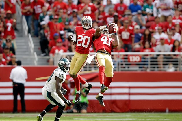 SANTA CLARA, CA - SEPTEMBER 28:  Antoine Bethea #41 of the San Francisco 49ers intercepts the ball while he and Perrish Cox #20 were covering Jeremy Maclin #18 of the Philadelphia Eagles at Levi's Stadium on September 28, 2014 in Santa Clara, California.  (Photo by Ezra Shaw/Getty Images)