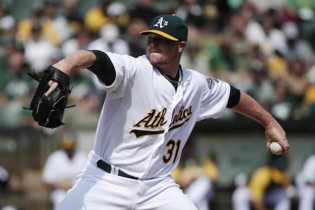 Oakland Athletics starting pitcher Jon Lester throws to the Los Angeles Angels during the first inning of a baseball game on Wednesday, Sept. 24, 2014, in Oakland, Calif. (AP Photo/Marcio Jose Sanchez)