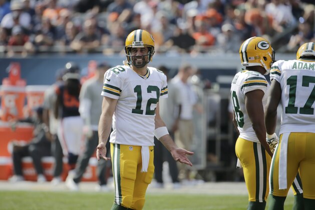 Green Bay Packers quarterback Aaron Rodgers (12) looks to the sidelines in the first half of an NFL football game against the Chicago Bears Sunday, Sept. 28, 2014, in Chicago. (AP Photo/Charles Rex Arbogast)
