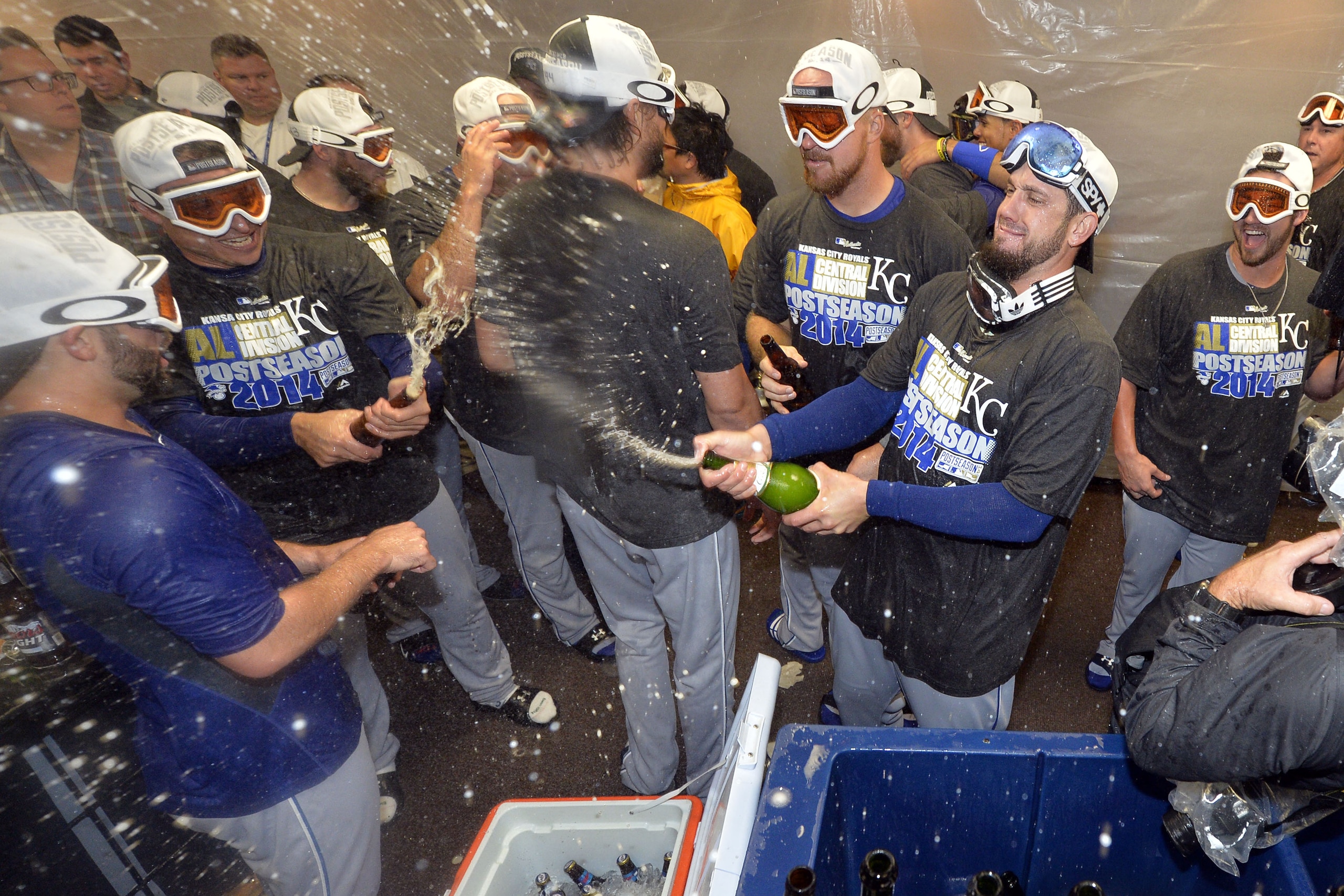 CHICAGO, IL - SEPTEMBER 26:  The Kansas City Royals celebrate in the locker room after defeating the Chicago White Sox to clinch a Wild Card berth at U.S. Cellular Field on September 26, 2014 in Chicago, Illinois. The Royals defeated the White Sox 3-1.  (Photo by Brian Kersey/Getty Images)