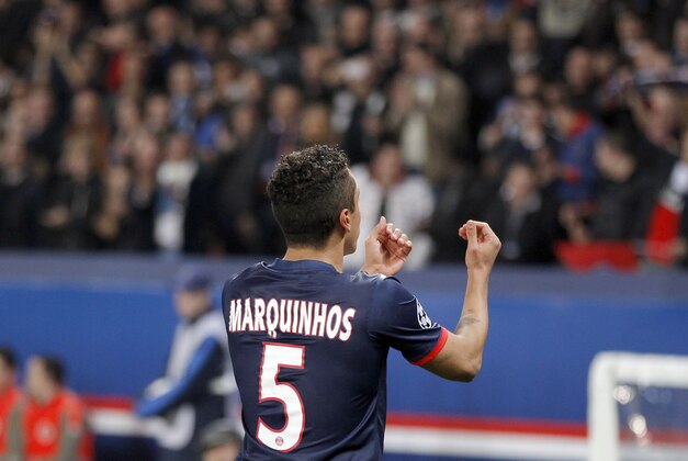 PSG's Marquinhos celebrates his side's first goal during a Champions League last 16 second leg soccer match between Paris Saint Germain and Bayer Leverkusen at Parc des Princes stadium in Paris, Wednesday, March 12, 2014. (AP Photo/Michel Euler)