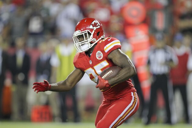 Kansas City Chiefs running back Jamaal Charles runs with the ball  during the first quarter of an NFL football game against the New England Patriots Monday, Sept. 29, 2014, in Kansas City, Mo. (AP Photo/Ed Zurga)
