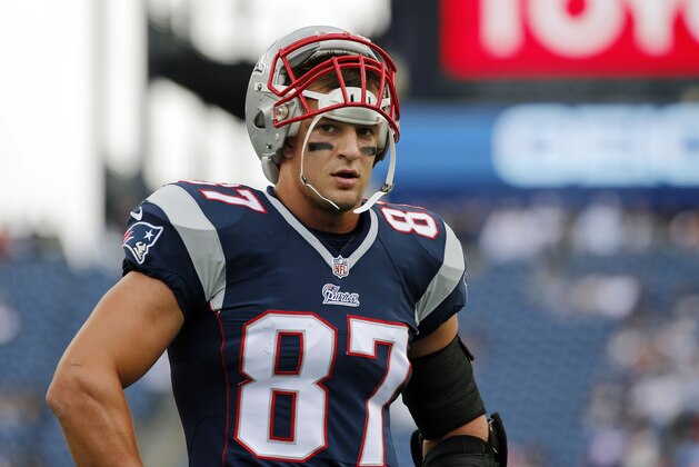 New England Patriots tight end Rob Gronkowski pauses during warm-up's before an NFL football game against the Oakland Raiders Sunday, Sept. 21, 2014, in Foxborough, Mass. (AP Photo/Elise Amendola)
