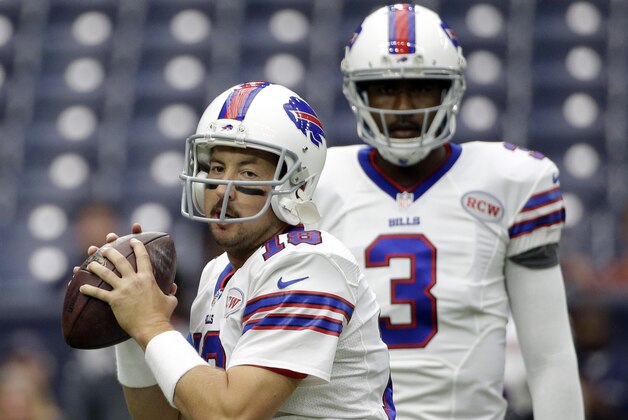 Buffalo Bills' Kyle Orton (18) throws as EJ Manuel (3) looks on prior to an NFL football game against the Houston, Sunday, Sept. 28, 2014, in Houston. (AP Photo/David J. Phillip)