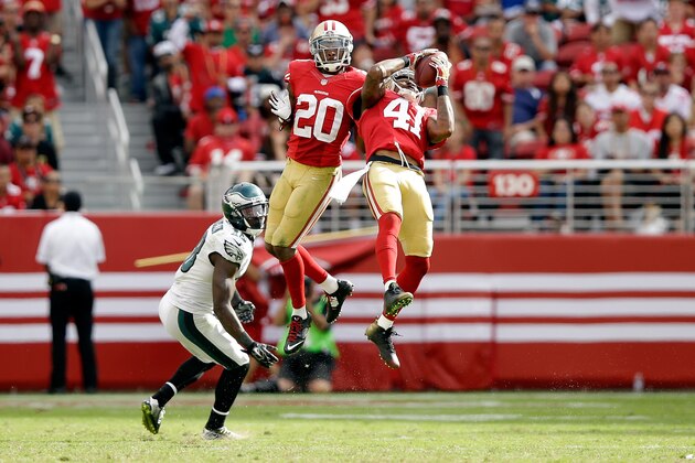 SANTA CLARA, CA - SEPTEMBER 28:  Antoine Bethea #41 of the San Francisco 49ers intercepts the ball while he and Perrish Cox #20 were covering Jeremy Maclin #18 of the Philadelphia Eagles at Levi's Stadium on September 28, 2014 in Santa Clara, California.  (Photo by Ezra Shaw/Getty Images)