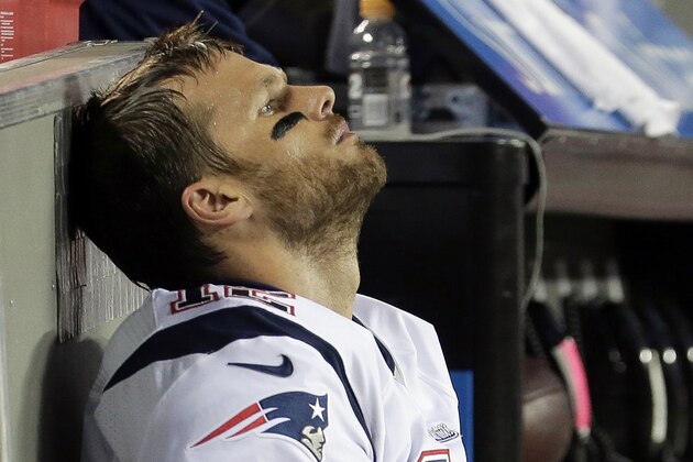 New England Patriots quarterback Tom Brady sits on the bench during the fourth quarter of an NFL football game against the Kansas City Chiefs, Monday, Sept. 29, 2014, in Kansas City, Mo. The Chiefs won 41-14. (AP Photo/Charlie Riedel)