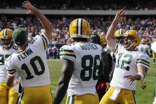 Green Bay Packers quarterback Aaron Rodgers (12) celebrates a touchdown with quarterback Matt Flynn (10) in the second half of an NFL football game against the Chicago Bears Sunday, Sept. 28, 2014, in Chicago. (AP Photo/Charles Rex Arbogast) Green Bay Packers quarterback Aaron Rodgers (12) celebrates a touchdown with quarterback Matt Flynn (10) in the second half of an NFL football game against the Chicago Bears Sunday, Sept. 28, 2014, in Chicago. (AP Photo/Charles Rex Arbogast)