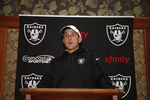 Oakland Raiders head coach Dennis Allen answers a reporter's question during a media conference following a training session at Pennyhill Park, Bagshot, England, Friday, Sept. 26, 2014. The Raiders will play the Miami Dolphins in an NFL football game at London's Wembley Stadium on Sunday Sept. 28.(AP Photo/Lefteris Pitarakis)