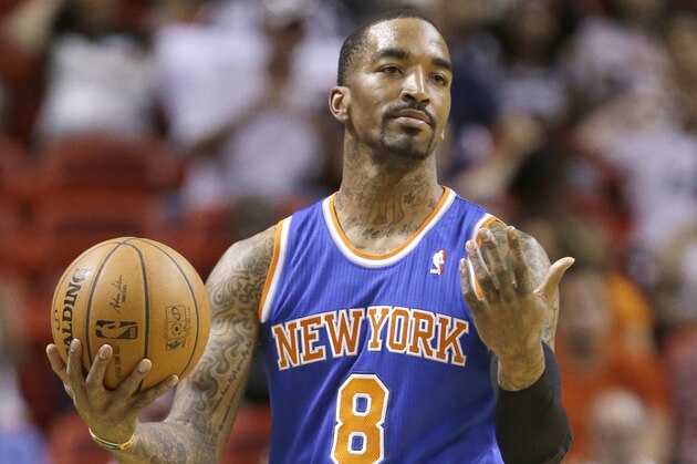 New York Knicks guard J.R. Smith reacts to a call during the first half of an NBA basketball game against the Miami Heat, Sunday, April 6, 2014 in Miami. (AP Photo/Wilfredo Lee)