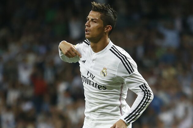 Real's Cristiano Ronaldo celebrates his goal during a Spanish La Liga soccer match between Real Madrid and Elche at the Santiago Bernabeu stadium in Madrid, Spain, Tuesday, Sept. 23, 2014. (AP Photo/Andres Kudacki)