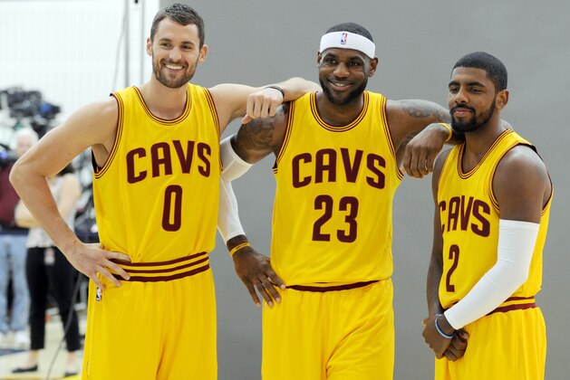 Sep 26, 2014; Cleveland, OH, USA; Cleveland Cavaliers forward Kevin Love (0), forward LeBron James (23) and guard Kyrie Irving (2) pose for a photo  during media day at Cleveland Clinic Courts. Mandatory Credit: Ken Blaze-USA TODAY Sports