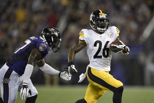 Pittsburgh Steelers running back Le'Veon Bell (26) runs with the ball against Baltimore Ravens inside linebacker C.J. Mosley (57) during the first half of an NFL football game Thursday, Sept. 11, 2014, in Baltimore. (AP Photo/Nick Wass)