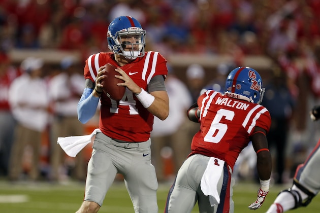 Mississippi quarterback Bo Wallace (14) readies to pass in the first half of an NCAA college football game against Memphis in Oxford, Miss., Saturday, Sept. 27, 2014.  (AP Photo/Rogelio V. Solis)