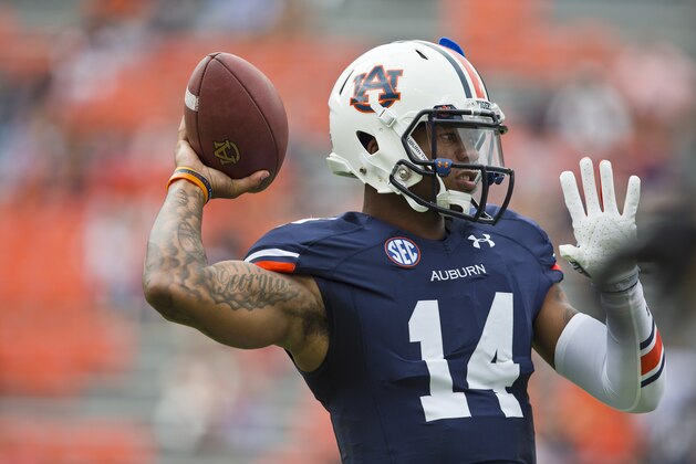 Auburn quarterback Nick Marshall (14) warms up before an NCAA college football game against Louisiana Tech, Saturday, Sept. 27, 2014, in Auburn, Ala.(AP Photo/Brynn Anderson)