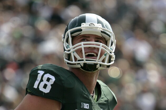 Michigan State quarterback Connor Cook celebrates after a first-quarter touchdown against Eastern Michigan during an NCAA college football game, Saturday, Sept. 20, 2014, in East Lansing, Mich. Michigan State won 73-14. (AP Photo/Al Goldis)