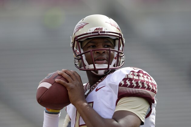 Florida State's quarterback Jameis Winston warms up prior to an NCAA college football game against North Carolina State in Raleigh, N.C., Saturday, Sept. 27, 2014. (AP Photo/Gerry Broome)