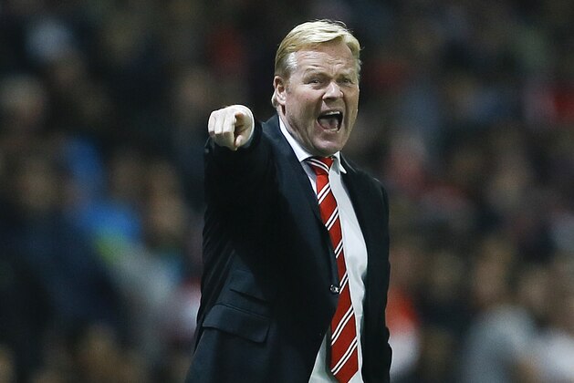 Southampton's manager Ronald Koeman shouts to his players during the English League Cup soccer match between Arsenal and Southampton at Emirates Stadium in London, Tuesday, Sept. 23, 2014. (AP Photo/Kirsty Wigglesworth)