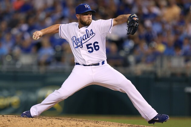 KANSAS CITY, MO - SEPTEMBER 3:  Greg Holland #56 of the Kansas City Royals throws in the ninth inning against the Texas Rangers at Kauffman Stadium on September 3, 2014 in Kansas City, Missouri. (Photo by Ed Zurga/Getty Images)