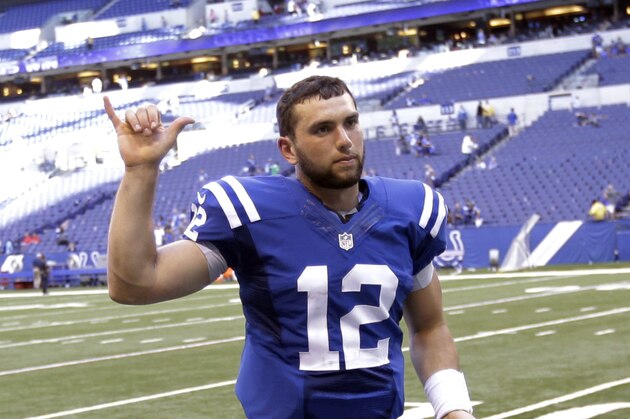 Indianapolis Colts quarterback Andrew Luck waves to fans as he leaves the field following an NFL football game against the Tennessee Titans in Indianapolis, Sunday, Sept. 28, 2014. The Colts defeated the Titans 41-17. (AP Photo/Darron Cummings)