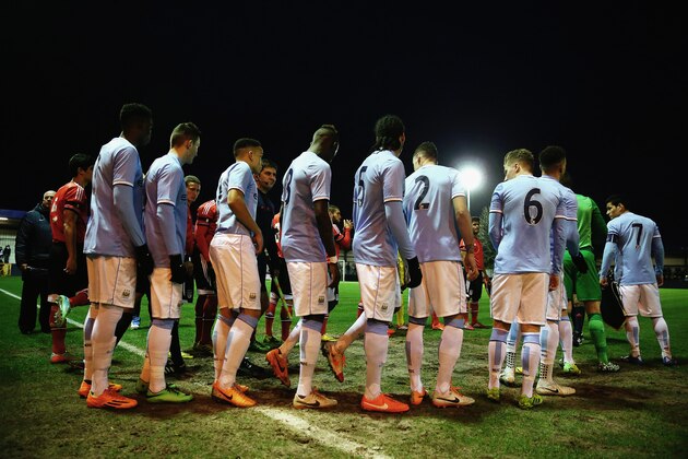 HYDE, ENGLAND - MARCH 18:  The players of Manchester City wait to enter the pitch prior to the UEFA Youth League Quarter Final match between Manchester City v SL Benfica at Ewen Fields on March 18, 2014 in Hyde, England.  (Photo by Alex Livesey/Getty Images)