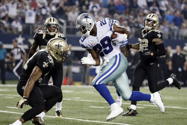 Dallas Cowboys' DeMarco Murray (29) sprints to the end zone for a touchdown as New Orleans Saints' Jairus Byrd, left, attempts the the stop during the second half of an NFL football game, Sunday, Sept. 28, 2014, in Arlington, Texas. The Saints' Kenny Vaccaro (32) and Corey White (24) watch on the play.  (AP Photo/Brandon Wade)
