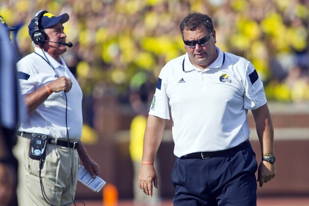 Michigan head coach Brady Hoke, right, reacts on the sideline next to defensive coordinator Greg Mattison, left, in the second quarter of an NCAA college football game against Minnesota in Ann Arbor, Mich., Saturday, Sept. 27, 2014. (AP Photo/Tony Ding)