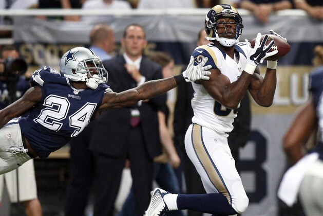 St. Louis Rams wide receiver Brian Quick, right, catches a 51-yard pass for a touchdown as Dallas Cowboys cornerback Morris Claiborne defends during the second quarter of an NFL football game Sunday, Sept. 21, 2014, in St. Louis. (AP Photo/Scott Kane)