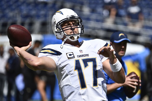 San Diego Chargers quarterback Philip Rivers gets loose during warmups before an NFL football game against the Jacksonville Jaguars Sunday, Sept. 28, 2014, in San Diego.  (AP Photo/Denis Poroy)