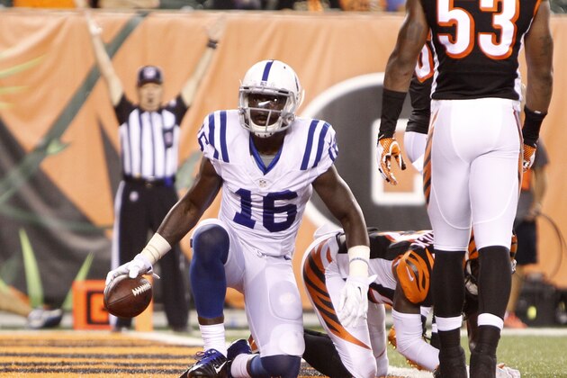 Indianapolis Colts wide receiver Da'Rick Rogers (16) scores a touchdown against the Cincinnati Bengals in the second half of an NFL preseason football game, Thursday, Aug. 28, 2014, in Cincinnati. (AP Photo/Frank Victores)