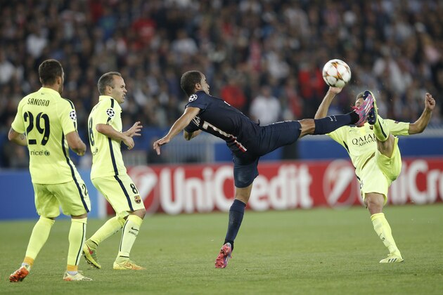 Barcelona's Jordi Alba, right, and PSG's Lucas battle for the ball during the Champions League soccer match between PSG and Barcelona, at the Parc des Princes stadium, in Paris, Tuesday, Sept. 30, 2014. (AP Photo/Christophe Ena)